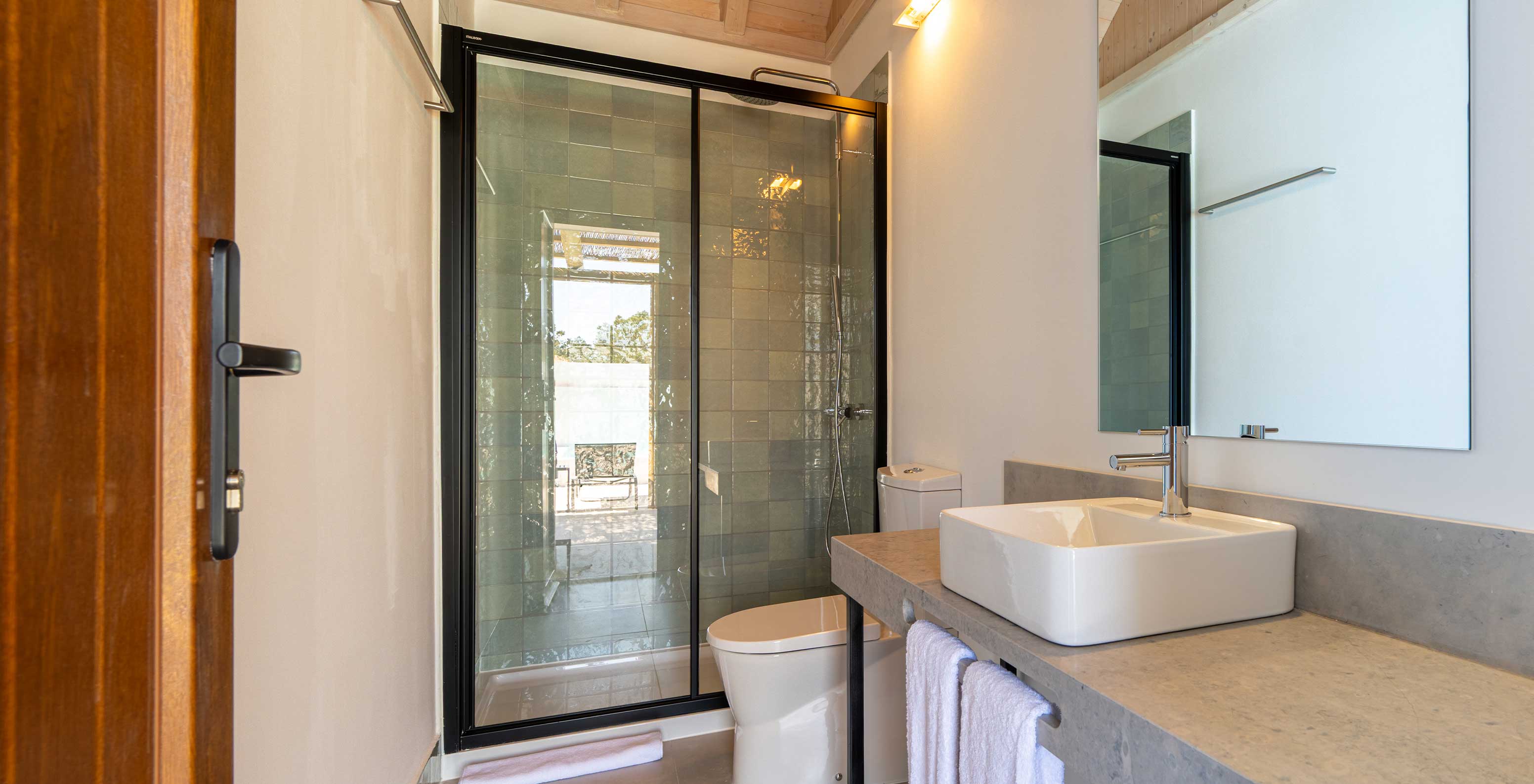 The Premium Villa at Pestana Comporta Village Residences has a bathroom in gray tones with a shower