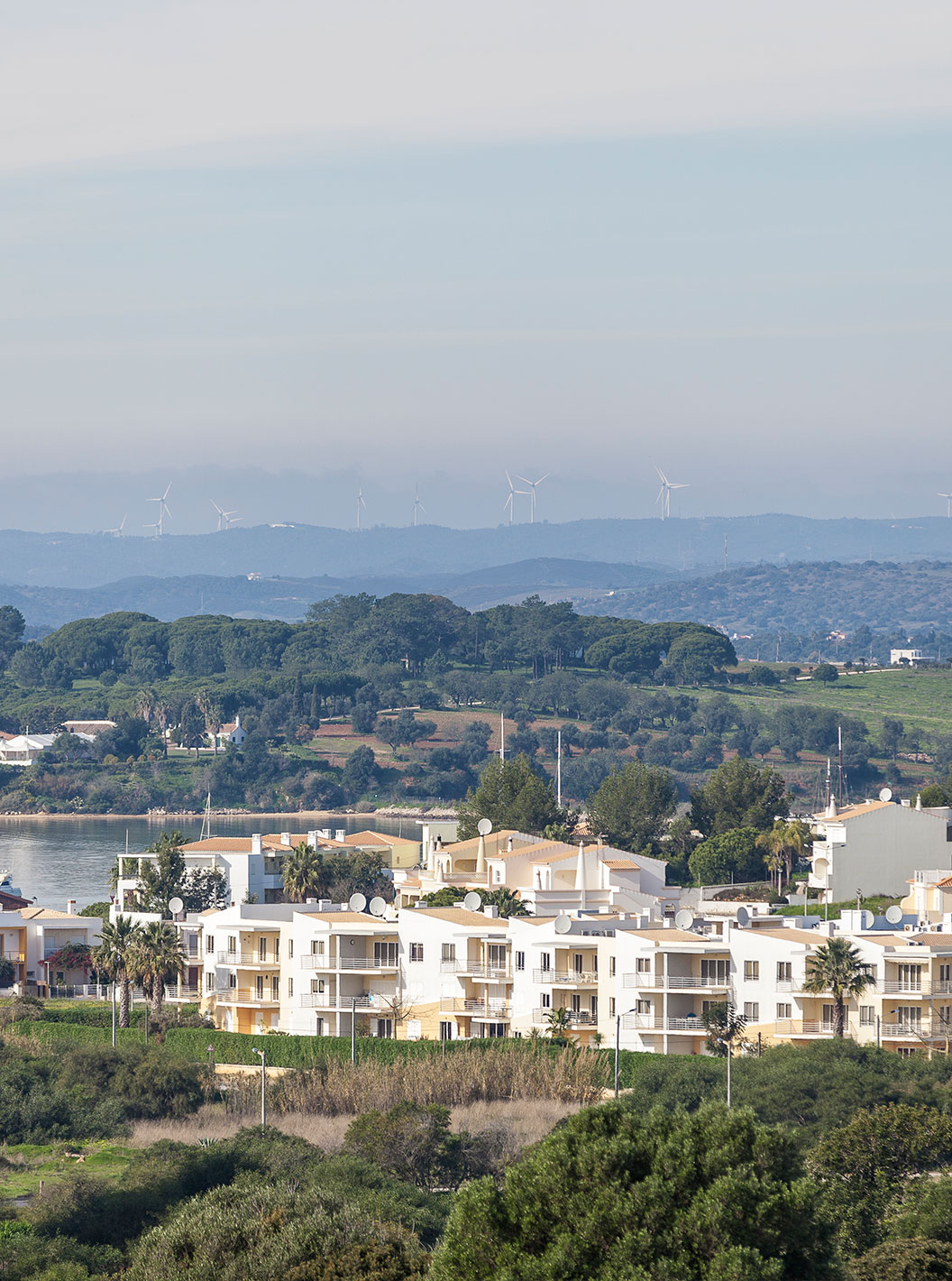 The T1 Garden View Apartment at Pestana Alvor Atlântico has a garden view of buildings and houses around the hotel