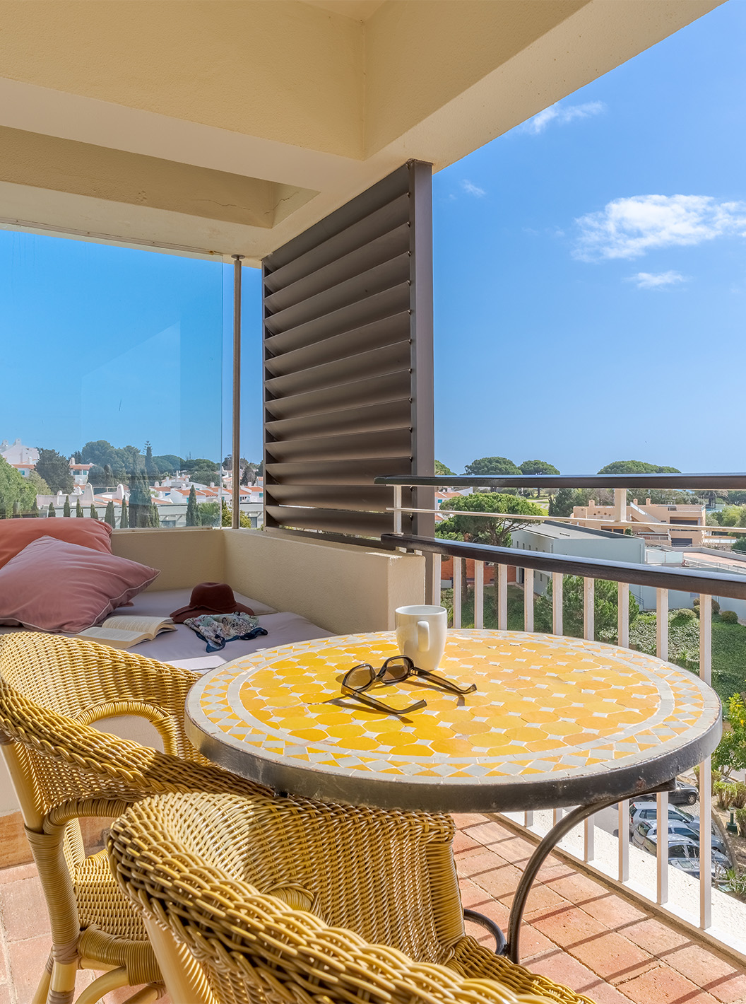 The Sea View Suite at Pestana Alvor Praia has a balcony with a table, chairs, and a sofa with sea views