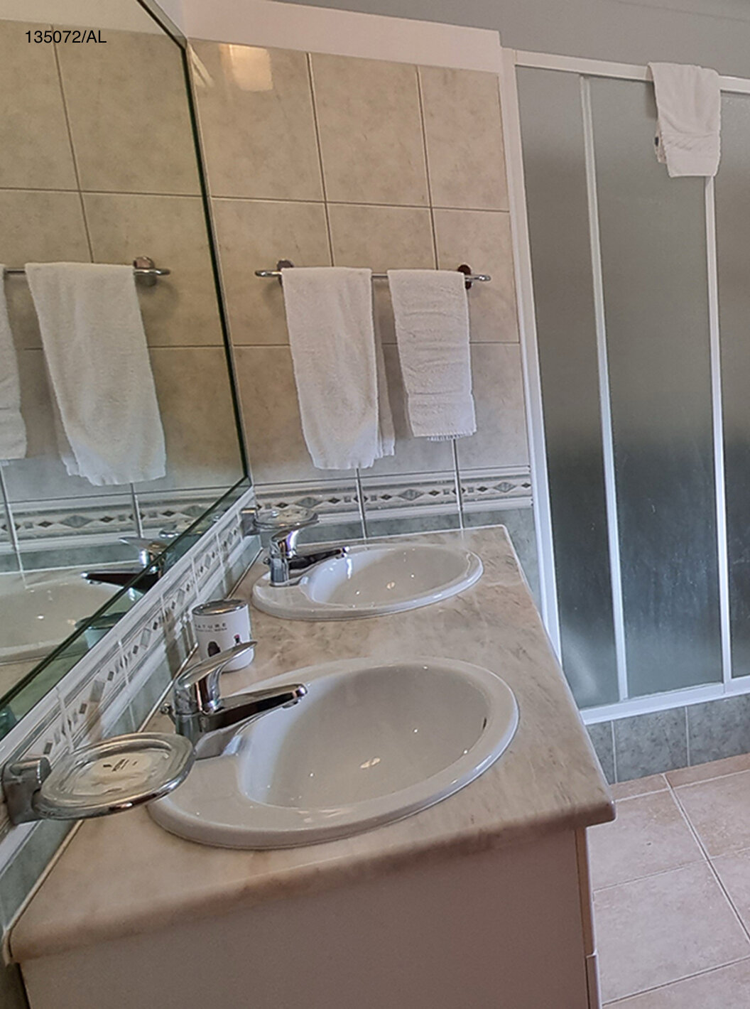 The Pestana Carvoeiro Golf V3 Standard Villa has a bathroom with a toilet, two sinks, and a shower