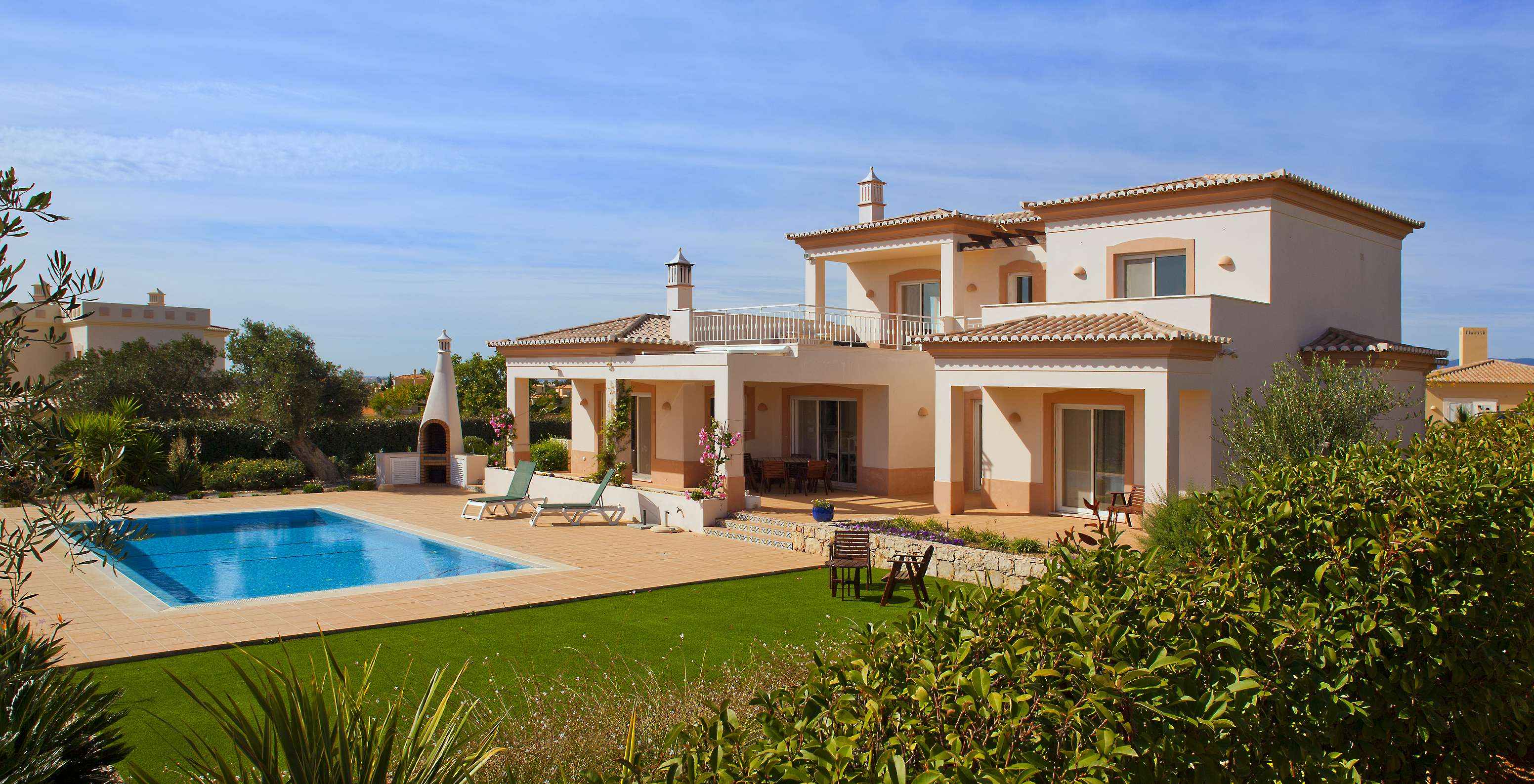 The V3 Villa at Pestana Gramacho Residences features a private garden with barbecue, pool, sun loungers, and chairs