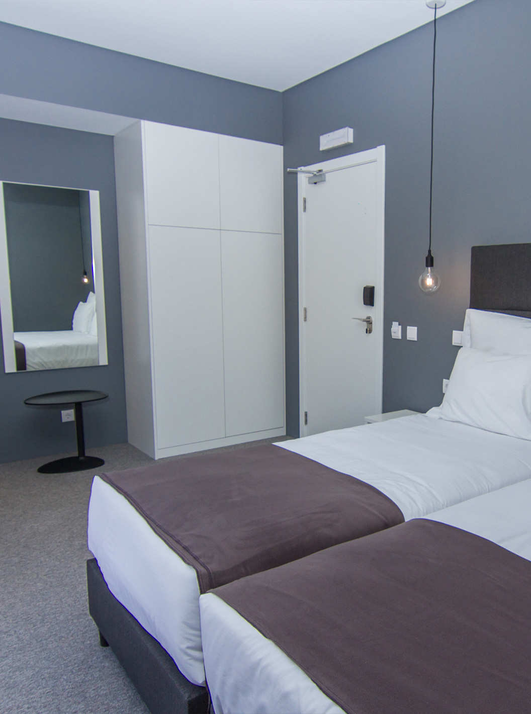 The Classic Room at Pestana Gramacho Residences is modern with 2 beds, kitchenette and seating area