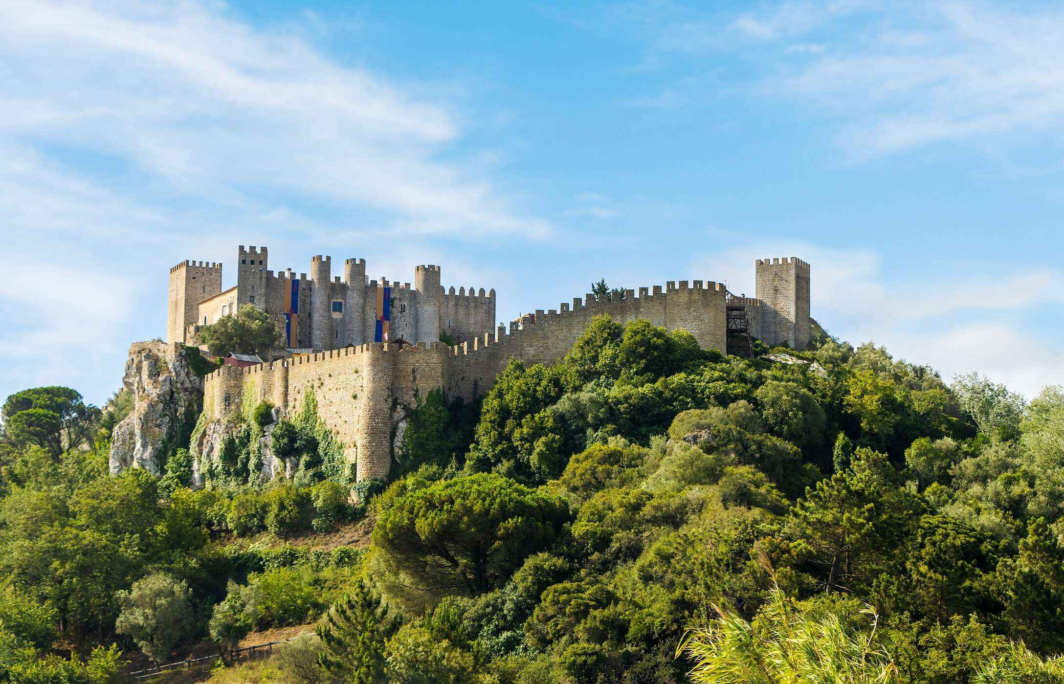 The Castle of Óbidos, with its imposing walls, holds medieval stories and offers stunning views of the village