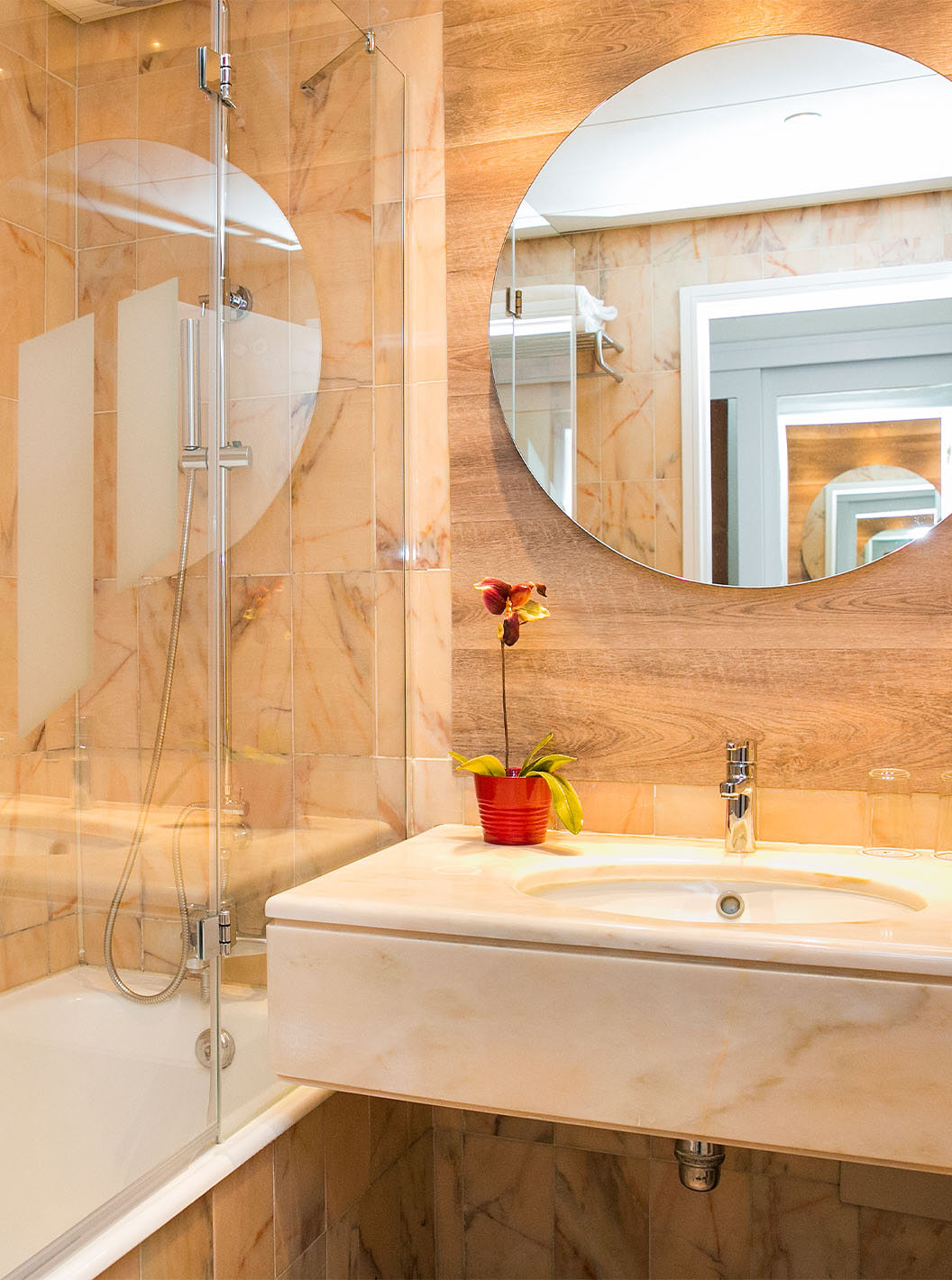 The Superior Deluxe room at Pestana Cascais has a bathroom with a mirror, sink, and bathtub