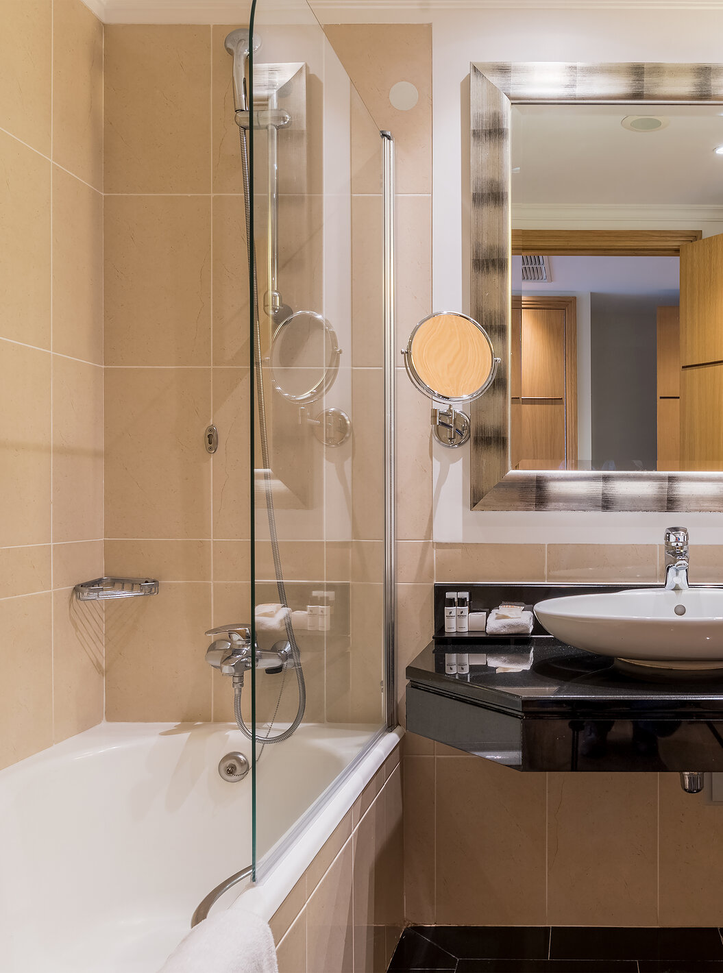 The Twin Superior Sea View Room at Pestana Grand has a bathroom with sink, bathtub with shower and towel