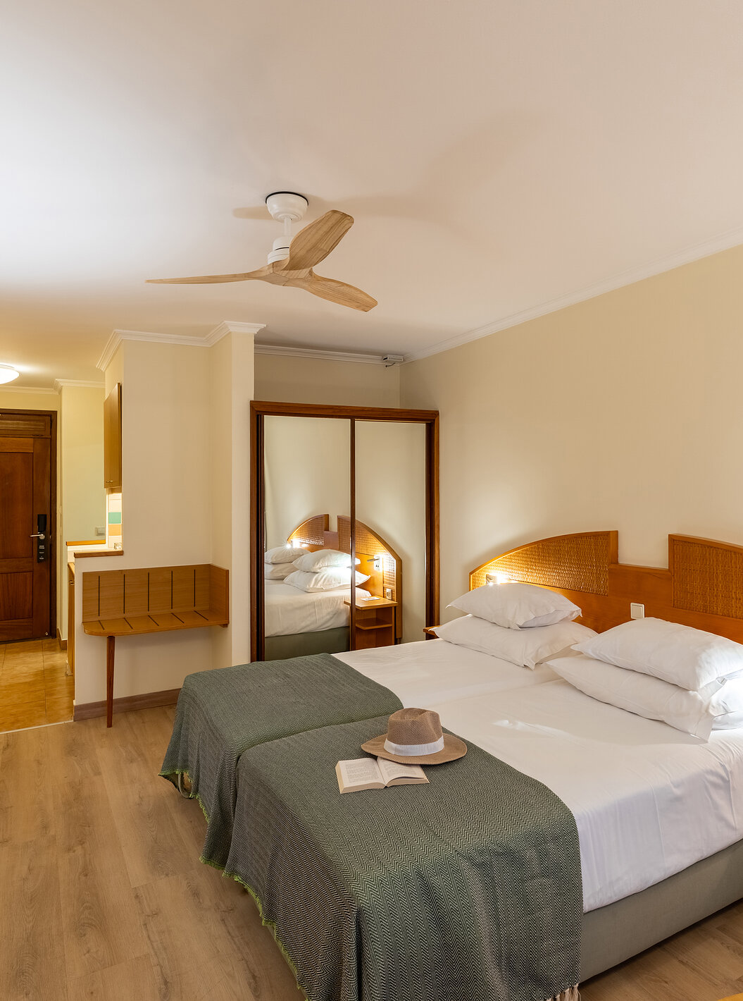 The Pestana Ocean Bay All Inclusive Classic Pool View has two single beds joined together with a green bedspread