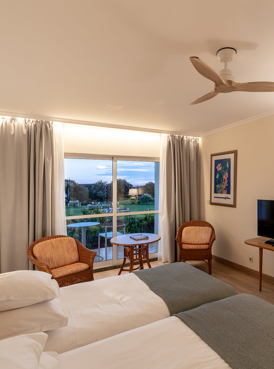 The Pestana Ocean Bay All Inclusive Classic Pool View has two single beds joined together, a garden view, and a TV cabinet