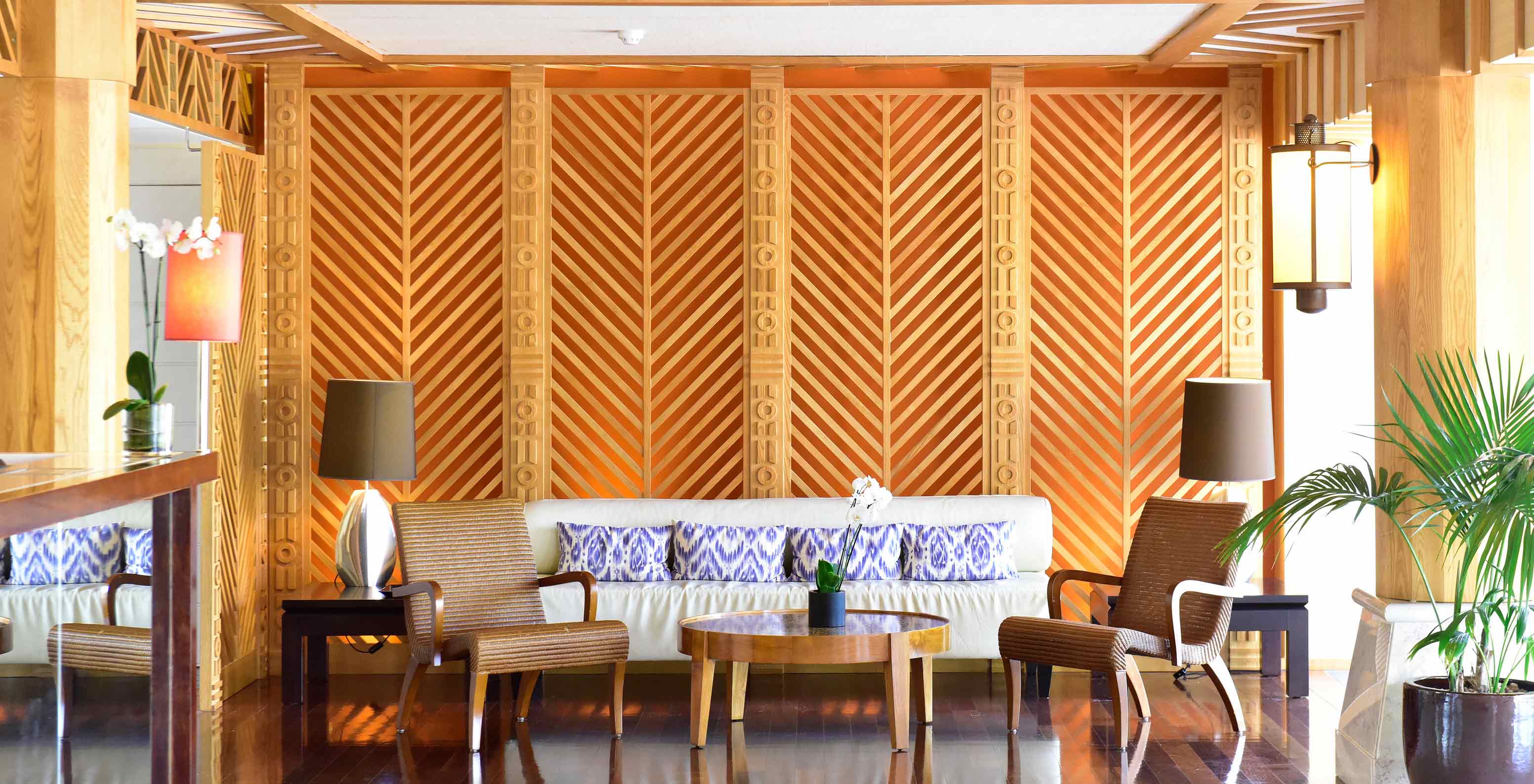Sofa, armchairs, coffee table in wood-decorated lounge at Pestana Porto Santo