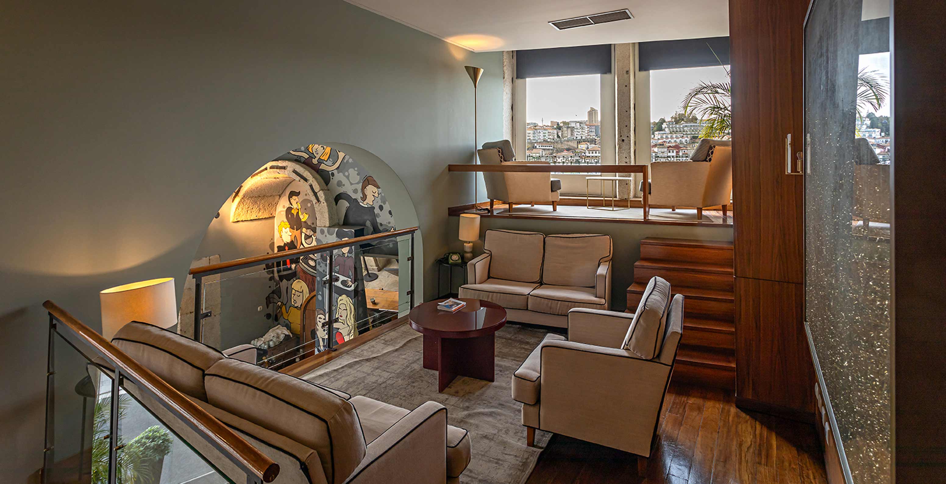 Mezzanine with sofas and armchairs on a rug at Pestana Vintage Porto, Hotel at Praça da Ribeira, in Porto