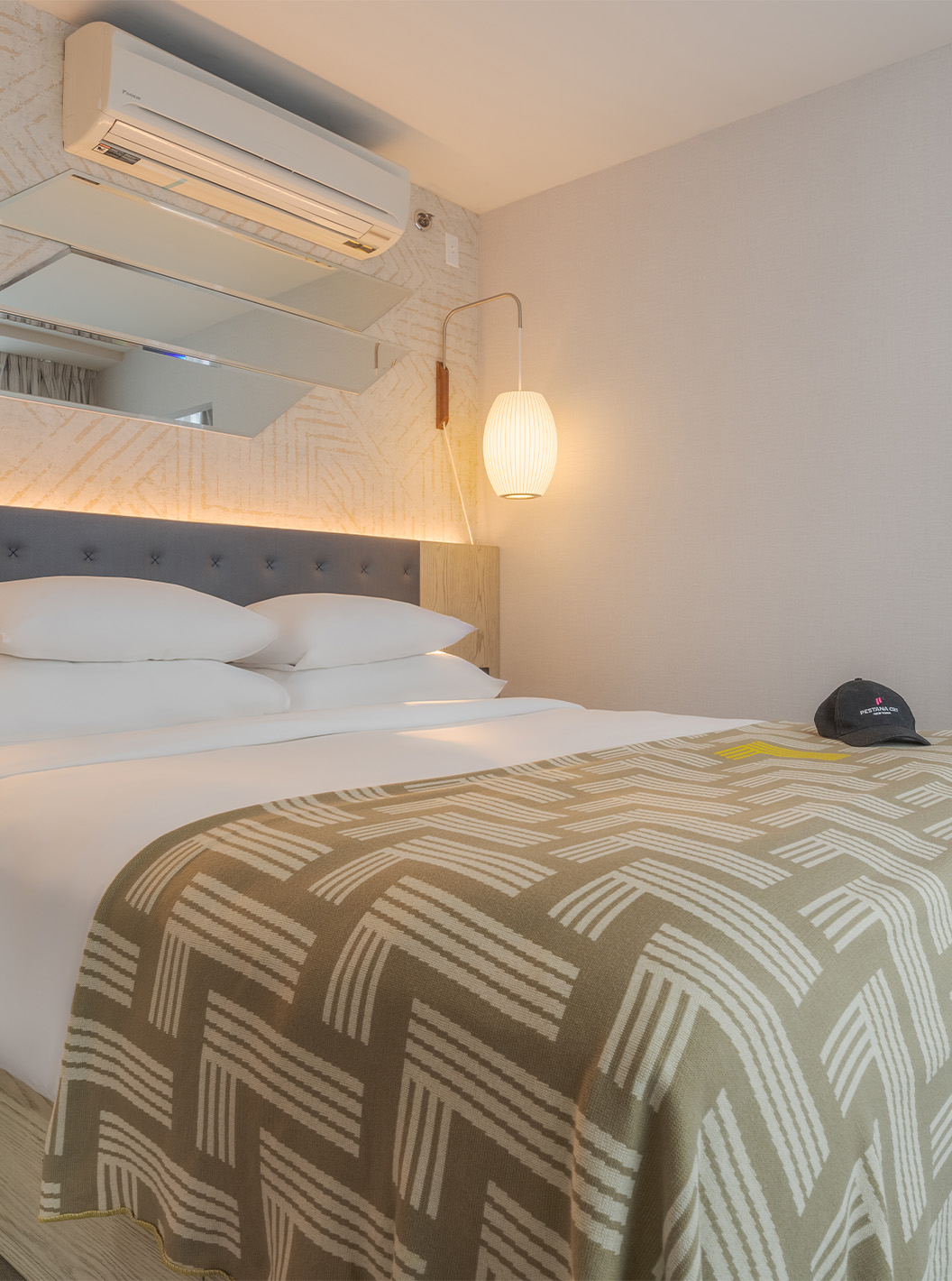 The Junior Suite with Balcony and View at Pestana CR7 Times Square has two beds with a bedspread with the number seven