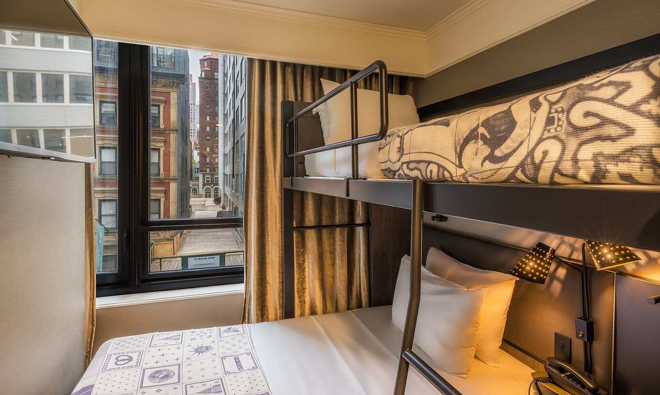 The Cabin room at Pestana Park Avenue has a bunk bed with two single beds and a view of the city