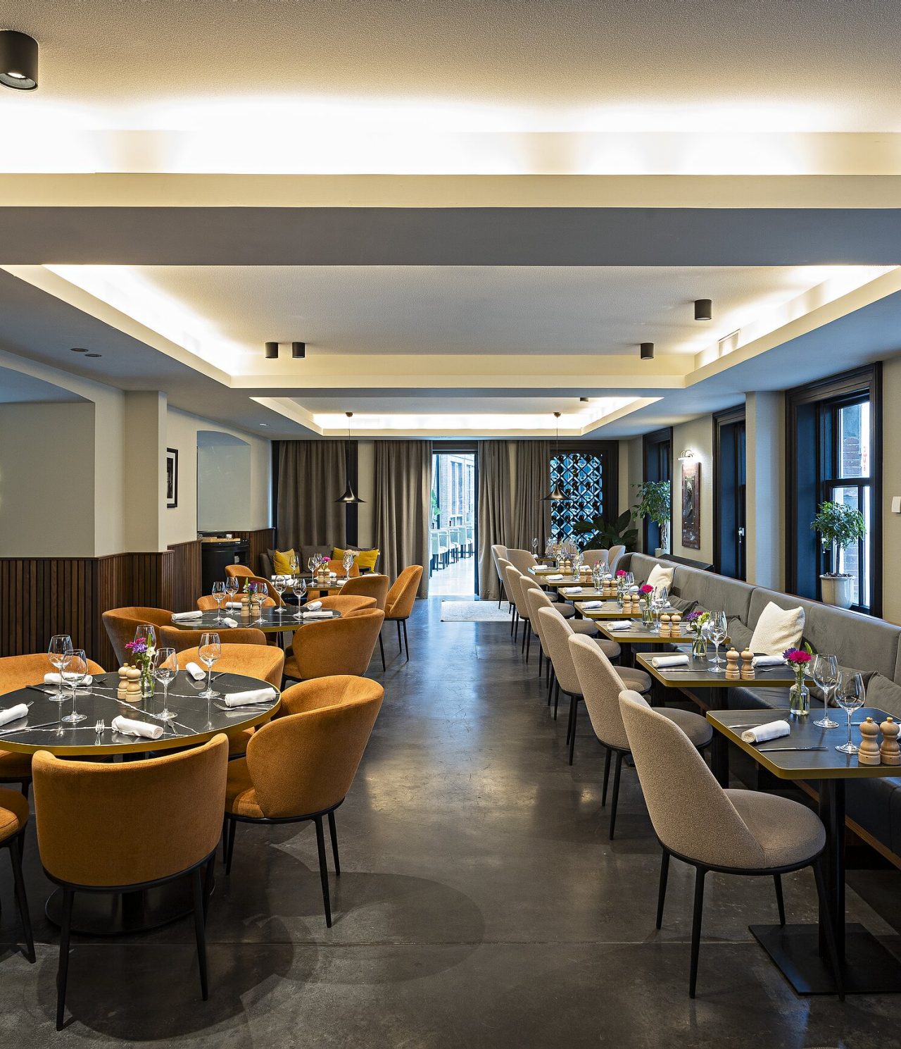 Archive has a spacious area with round and square tables and chairs