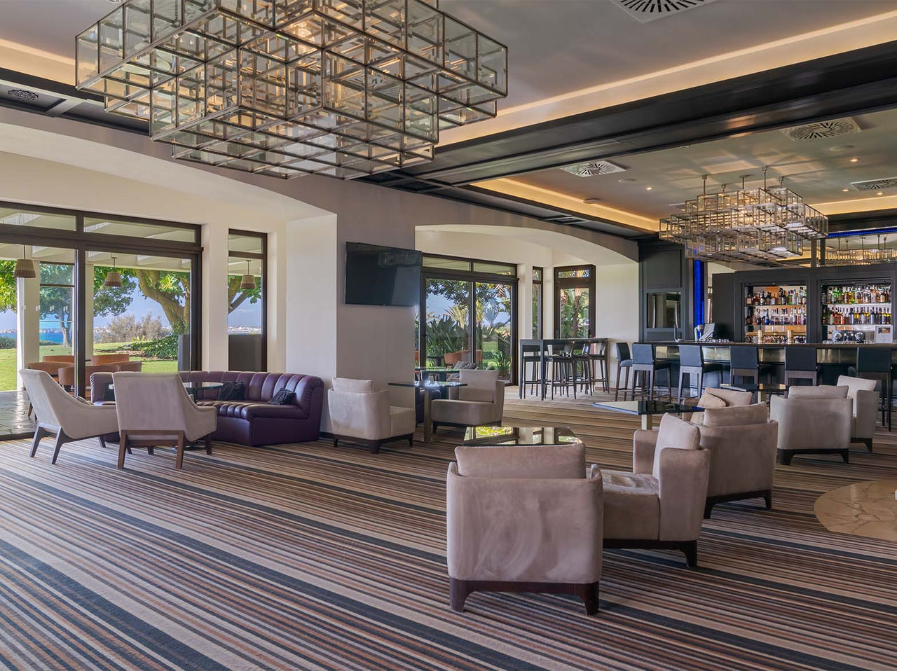 Bar D Henrique has sofas and chairs for drinks with sea and garden views