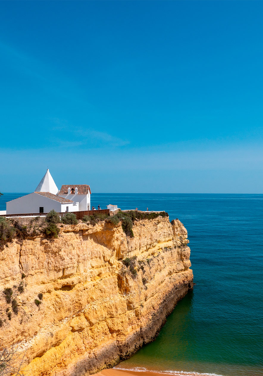 Chapel of Nossa Senhora da Rocha a white sanctuary atop a cliff overlooking the Atlantic Ocean