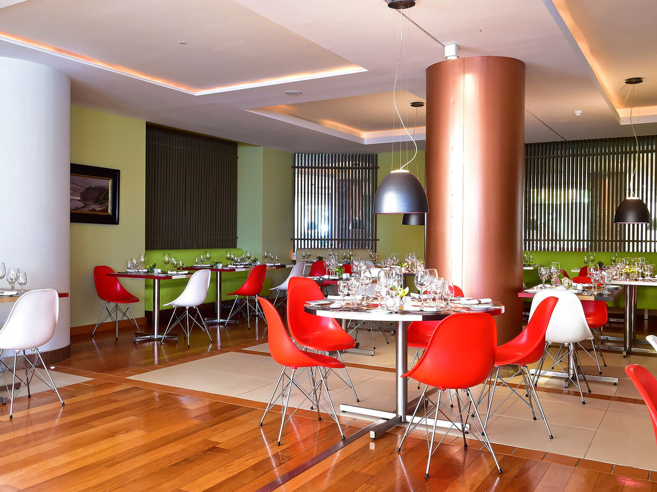 Deep Blue restaurant at the 4-star seaside hotel in Funchal has a spacious, naturally lit room and several tables