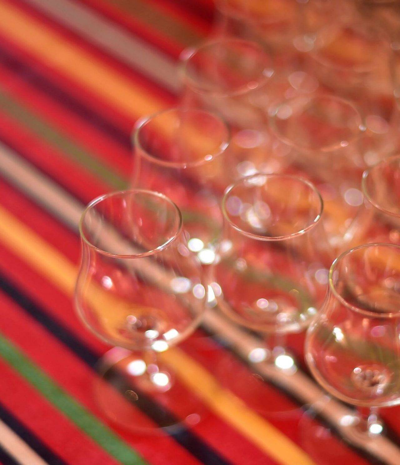 The Botanic restaurant, at the 5-Star Hotel in Funchal, has a table with a striped tablecloth and several glasses
